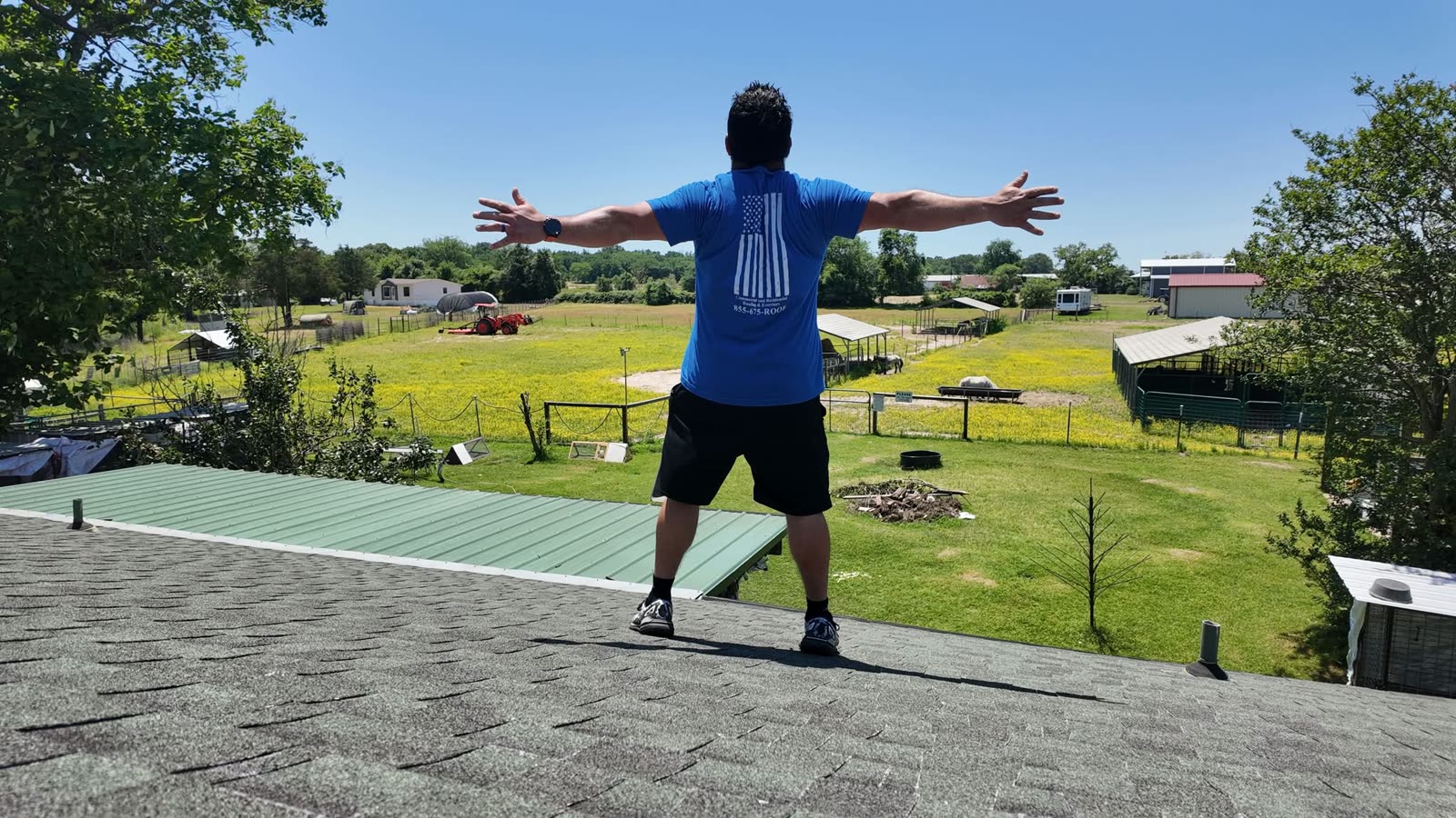 Tony Muñoz on a rooftop overlooking farmland